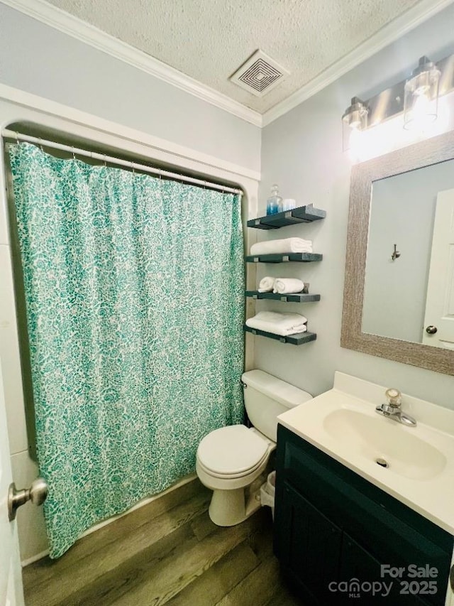 734 Forestbrook Dr, Gastonia, NC 28056 - full bathroom with wood finished floors, crown molding, vanity, a textured ceiling, and a shower with curtain