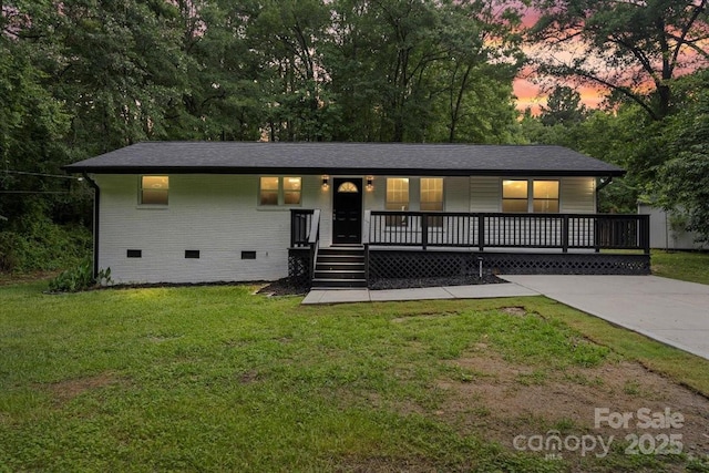 704 W Border St, Dallas, NC 28034 - view of front of home featuring crawl space, covered porch, a front yard, and brick siding