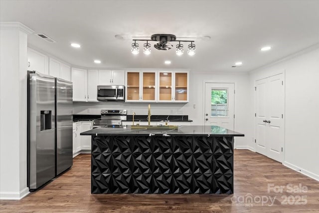 704 W Border St, Dallas, NC 28034 - kitchen featuring appliances with stainless steel finishes, dark countertops, white cabinetry, dark wood-style floors, and recessed lighting