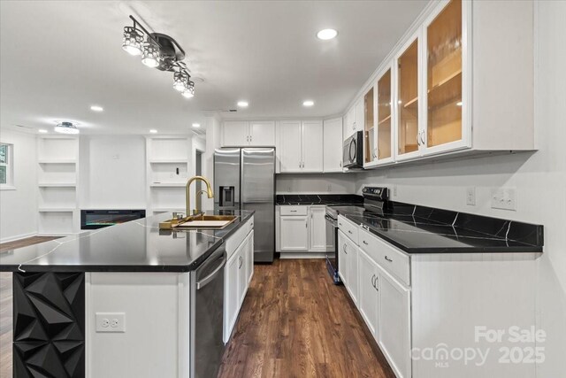 704 W Border St, Dallas, NC 28034 - kitchen featuring appliances with stainless steel finishes, a sink, dark countertops, white cabinets, and dark wood-type flooring