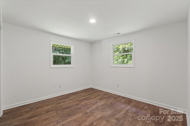 704 W Border St, Dallas, NC 28034 - unfurnished room featuring baseboards, dark wood-style floors, and recessed lighting