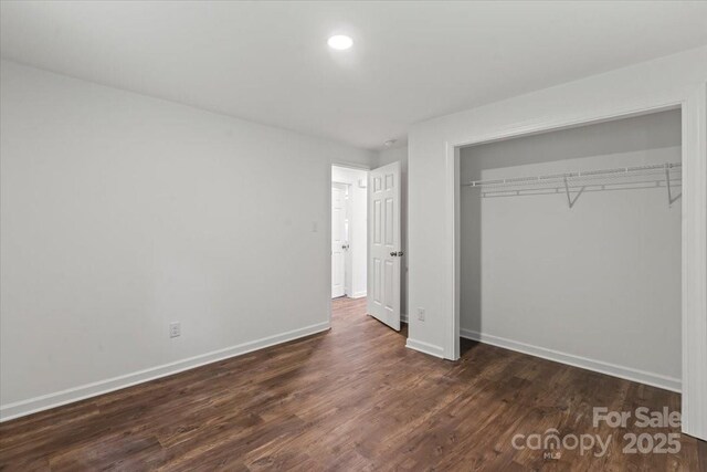 704 W Border St, Dallas, NC 28034 - unfurnished bedroom with baseboards, a closet, wood finished floors, and recessed lighting