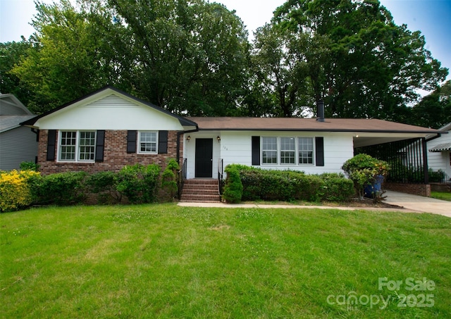 106 Edith Dr, Mauldin, SC 29662 - view of front facade with a front yard, driveway, an attached carport, and brick siding