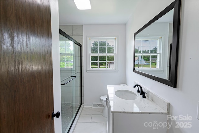 106 Edith Dr, Mauldin, SC 29662 - bathroom featuring vanity, toilet, a stall shower, and baseboards
