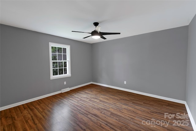 106 Edith Dr, Mauldin, SC 29662 - spare room with baseboards, dark wood-style floors, and a ceiling fan