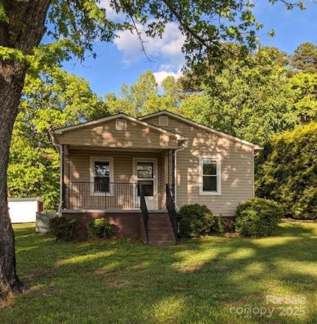 843 Summers Rd, Valdese, NC 28690 - bungalow-style house with covered porch and a front lawn