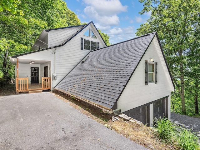505 Middle Top Loop, Maggie Valley, NC 28751 - view of side of home with roof with shingles, driveway, and a garage