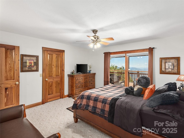 505 Middle Top Loop, Maggie Valley, NC 28751 - bedroom featuring access to exterior, carpet flooring, a ceiling fan, and baseboards