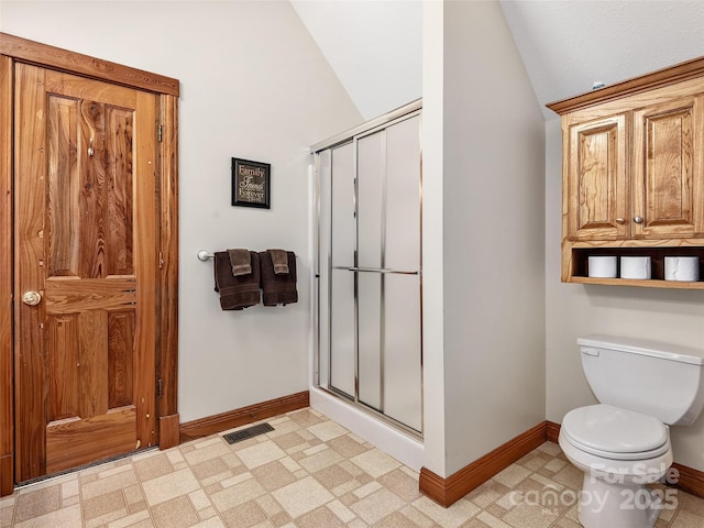 505 Middle Top Loop, Maggie Valley, NC 28751 - full bathroom featuring baseboards, vaulted ceiling, a shower stall, and toilet