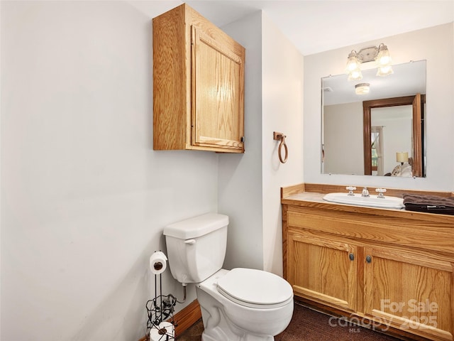505 Middle Top Loop, Maggie Valley, NC 28751 - half bathroom featuring toilet, vanity, and baseboards