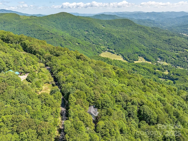 505 Middle Top Loop, Maggie Valley, NC 28751 - drone / aerial view of a heavily wooded area and a mountain backdrop