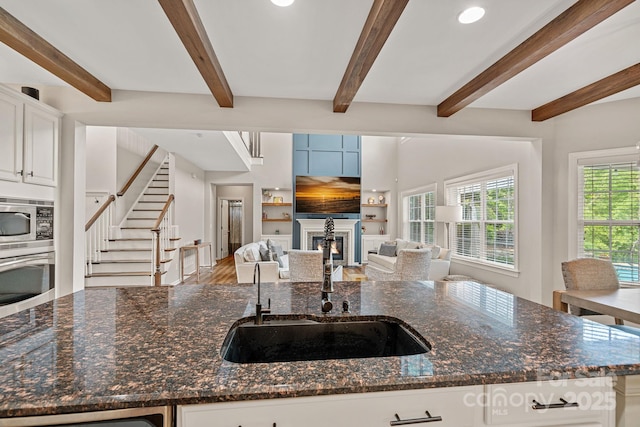 1849 Still Water Ln, Indian Land, SC 29707 - kitchen with a sink, open floor plan, dark stone counters, stainless steel appliances, and an island with sink