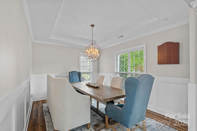 1849 Still Water Ln, Indian Land, SC 29707 - dining room featuring a raised ceiling, dark wood-type flooring, wainscoting, a chandelier, and crown molding