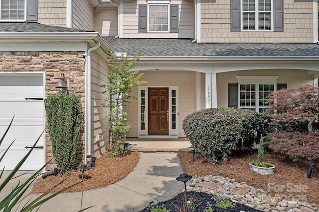 1849 Still Water Ln, Indian Land, SC 29707 - view of exterior entry featuring a porch, roof with shingles, and a garage