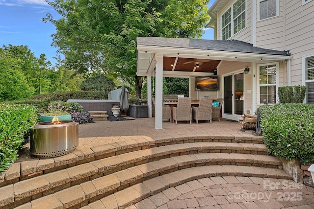 1849 Still Water Ln, Indian Land, SC 29707 - view of patio featuring a hot tub, a fire pit, and outdoor dining space