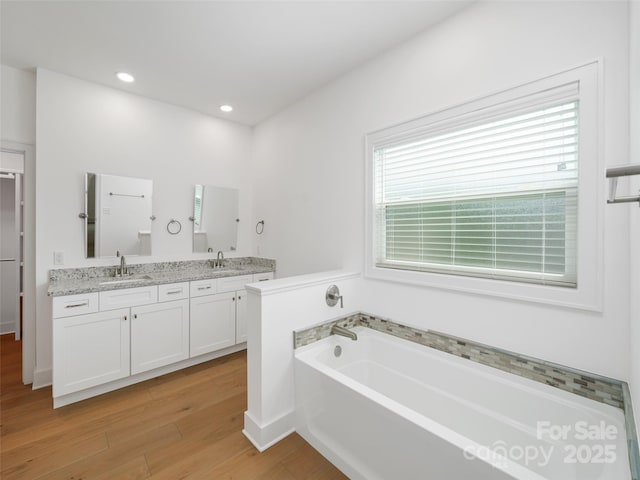 241 Millbrae Loop, Hendersonville, NC 28791 - full bath with wood finished floors, a bath, double vanity, recessed lighting, and baseboards