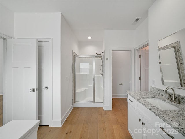 241 Millbrae Loop, Hendersonville, NC 28791 - bathroom with baseboards, vanity, a stall shower, wood finished floors, and recessed lighting