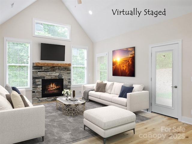241 Millbrae Loop, Hendersonville, NC 28791 - living area featuring high vaulted ceiling, wood finished floors, a ceiling fan, and a stone fireplace