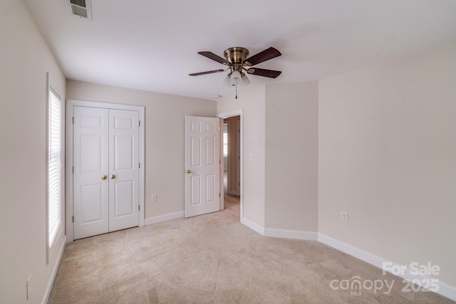 2065 Gable Way Ln, Matthews, NC 28104 - unfurnished bedroom with carpet floors, a closet, and ceiling fan