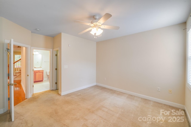 2065 Gable Way Ln, Matthews, NC 28104 - unfurnished bedroom with light carpet, ensuite bathroom, and a ceiling fan