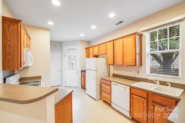 2065 Gable Way Ln, Matthews, NC 28104 - kitchen featuring white appliances, recessed lighting, light floors, a peninsula, and light countertops