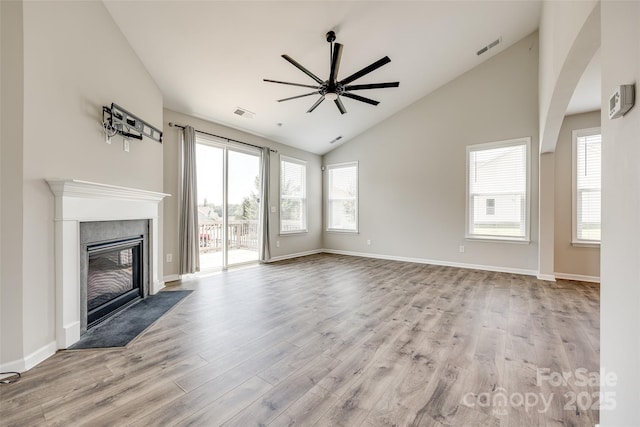 173 Morgans Branch Rd, Belmont, NC 28012 - unfurnished living room featuring ceiling fan, wood finished floors, a fireplace, baseboards, and high vaulted ceiling