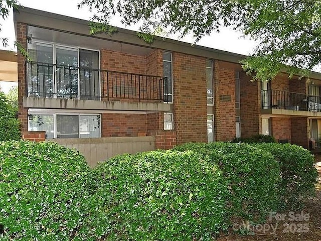 1807 S Hawthorne Rd, Winston Salem, NC 27103 - view of property exterior featuring brick siding and a balcony