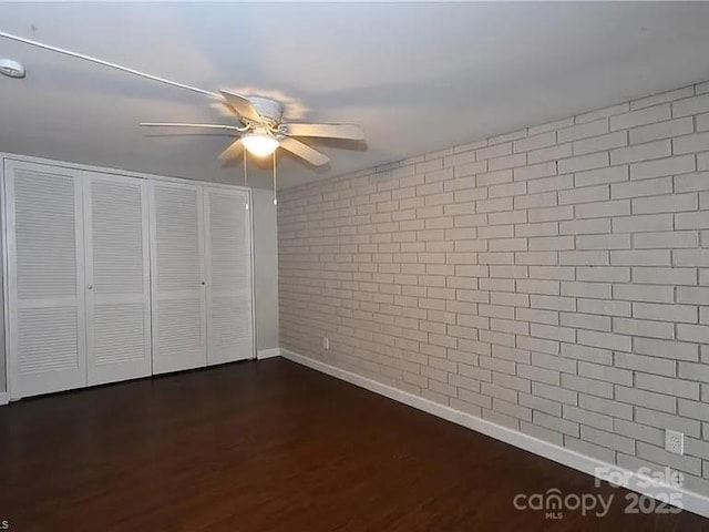 1807 S Hawthorne Rd, Winston Salem, NC 27103 - unfurnished bedroom with baseboards, dark wood-style flooring, a closet, and ceiling fan