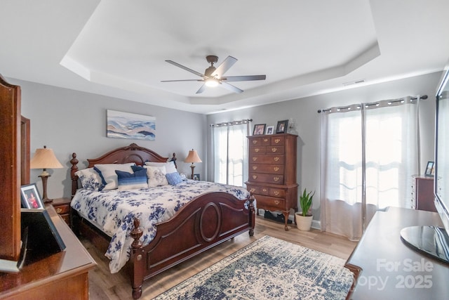 2737 Bobcat Rd, Heath Springs, SC 29058 - bedroom featuring a raised ceiling, wood finished floors, and ceiling fan