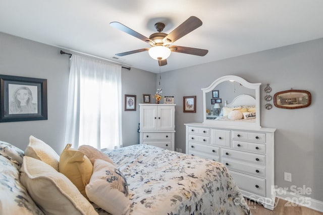 2737 Bobcat Rd, Heath Springs, SC 29058 - bedroom with light wood-style flooring, baseboards, and ceiling fan