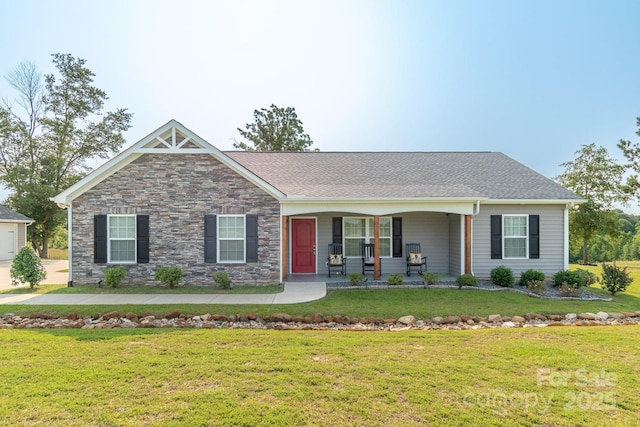 2737 Bobcat Rd, Heath Springs, SC 29058 - view of front facade with a front yard, covered porch, stone siding, and roof with shingles