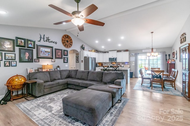 2737 Bobcat Rd, Heath Springs, SC 29058 - living area with lofted ceiling, baseboards, arched walkways, ceiling fan, and light wood-style floors