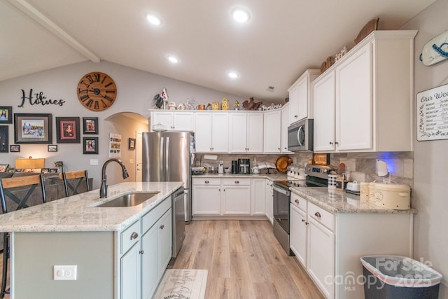 2737 Bobcat Rd, Heath Springs, SC 29058 - kitchen with appliances with stainless steel finishes, a sink, light wood-style flooring, white cabinets, and recessed lighting
