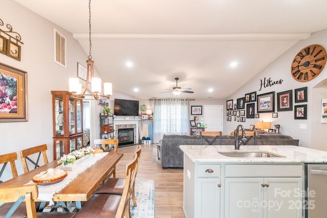 2737 Bobcat Rd, Heath Springs, SC 29058 - kitchen with a sink, dishwasher, light wood-type flooring, open floor plan, and recessed lighting