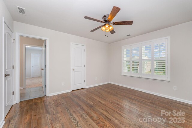 150 Haddonsfield Dr, Mooresville, NC 28115 - unfurnished bedroom featuring baseboards, wood finished floors, and a ceiling fan