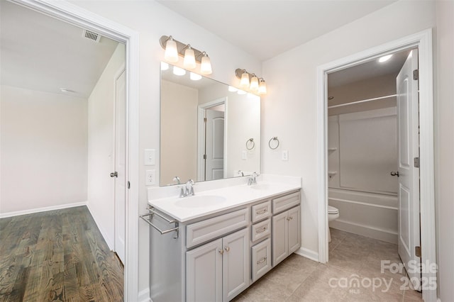 150 Haddonsfield Dr, Mooresville, NC 28115 - full bath with double vanity, toilet, baseboards, and washtub / shower combination