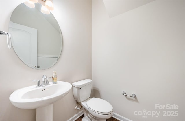 150 Haddonsfield Dr, Mooresville, NC 28115 - bathroom with toilet, baseboards, and a sink