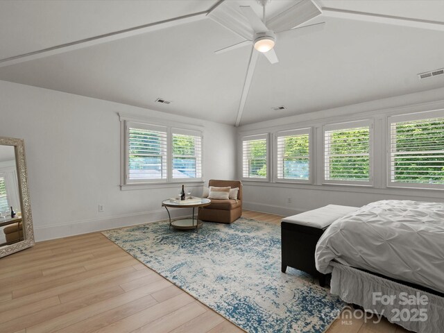 315 Mountainview Dr, Charlotte, NC 28270 - bedroom featuring vaulted ceiling, wood finished floors, baseboards, and a ceiling fan