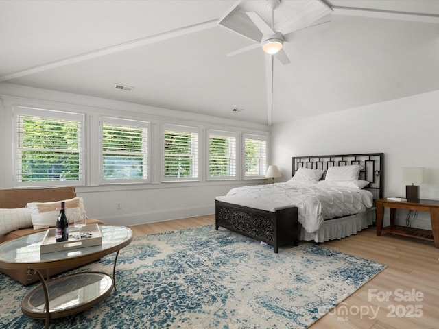 315 Mountainview Dr, Charlotte, NC 28270 - bedroom with vaulted ceiling, wood finished floors, and a ceiling fan