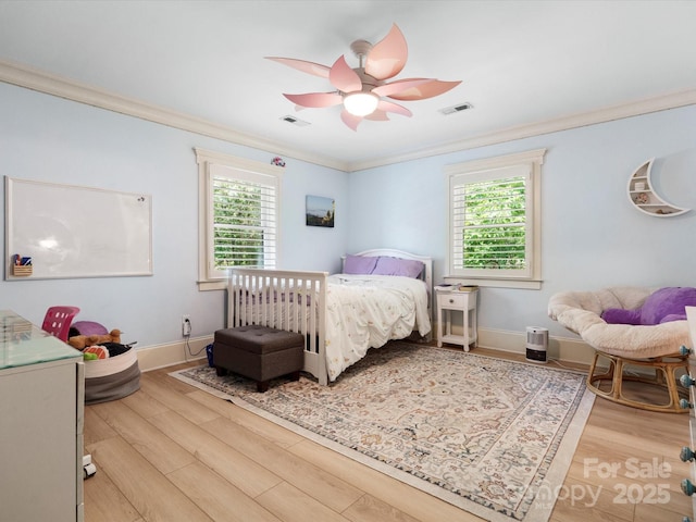 315 Mountainview Dr, Charlotte, NC 28270 - bedroom featuring crown molding, multiple windows, light wood finished floors, and ceiling fan