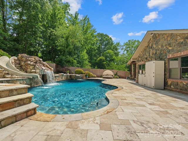 315 Mountainview Dr, Charlotte, NC 28270 - view of pool featuring a water slide, a fenced backyard, and a patio area