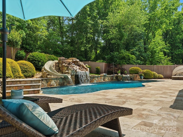 315 Mountainview Dr, Charlotte, NC 28270 - view of pool featuring a water slide, a patio, and a fenced backyard