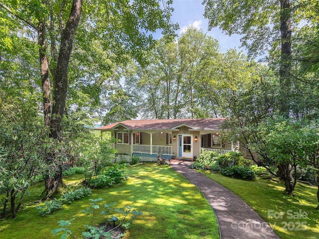 573 Valeria Ln, Pisgah Forest, NC 28768 - ranch-style home with covered porch and a front lawn