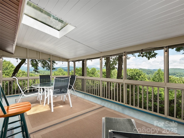 573 Valeria Ln, Pisgah Forest, NC 28768 - sunroom with lofted ceiling and a skylight