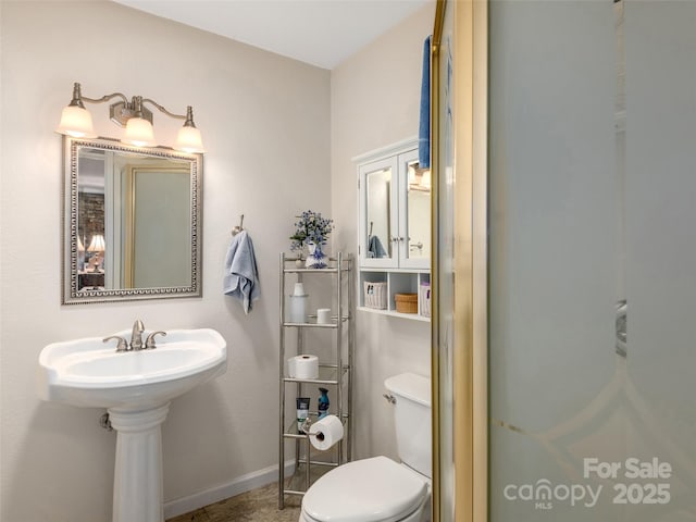 573 Valeria Ln, Pisgah Forest, NC 28768 - half bath featuring toilet and baseboards
