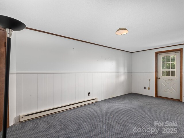 573 Valeria Ln, Pisgah Forest, NC 28768 - carpeted spare room with baseboard heating and wainscoting