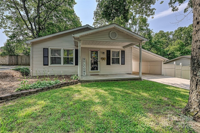 267 Buffalo Ave NW, Concord, NC 28025 - view of front of property with concrete driveway, a carport, and a porch