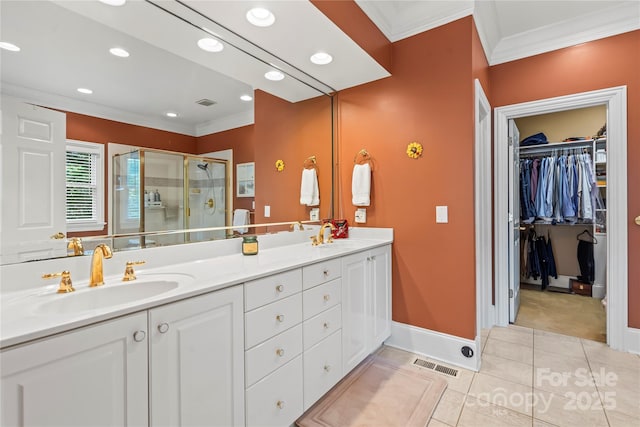 4740 Myers Ln, Harrisburg, NC 28075 - bathroom with crown molding, a shower stall, double vanity, tile patterned floors, and a spacious closet