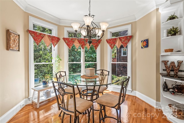 4740 Myers Ln, Harrisburg, NC 28075 - dining room featuring a chandelier, ornamental molding, and light wood-type flooring
