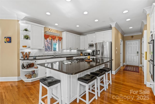 4740 Myers Ln, Harrisburg, NC 28075 - kitchen with appliances with stainless steel finishes, open shelves, crown molding, white cabinets, and recessed lighting